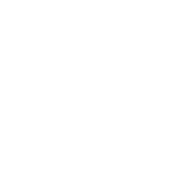 Photo of Alexandra Maccoll Garfinkel sitting outside in Denmark wearing a grey jacket.