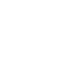 Photo of Alexandra Maccoll Garfinkel sitting outside in Denmark wearing a grey jacket.